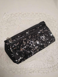 Pochettes à paillettes noires et argent